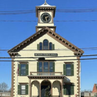 Acton Town Hall facade on a snow covered day.