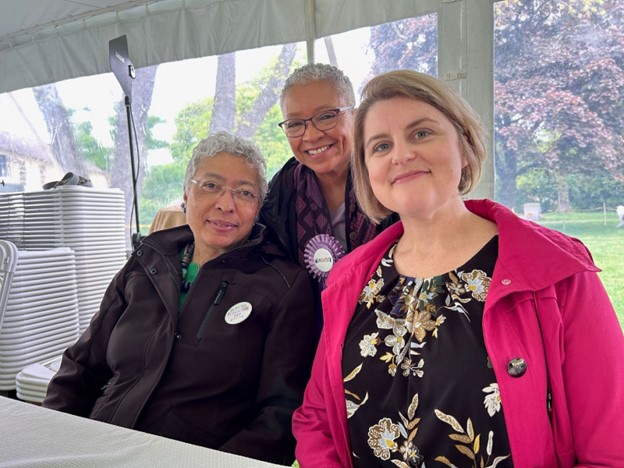 Three women posing for a photo.